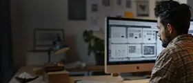 An Adobe InDesign Expert Working on Laptop