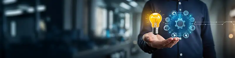 An healthcare professional standing with thumbs up gesture 