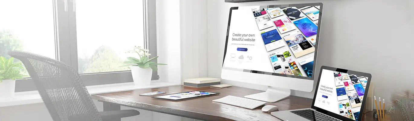 A computer, laptop, tablet and a mobile phone on a table. All displaying a same website page with a writing ' create your own beautiful website'