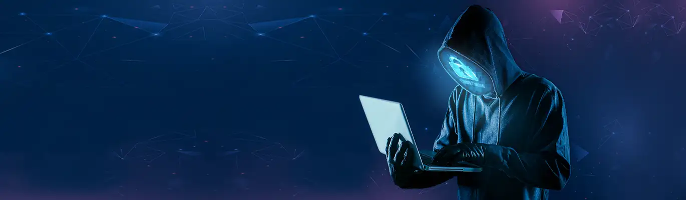 A hacker with his face replaced with a lock screen icon wearing a hoodie sitting in a dark environment with a laptop in hand 