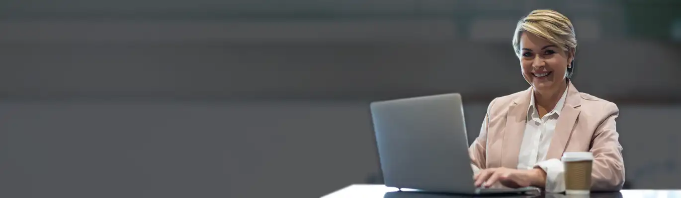 A financial expert sitting infront of a laptop 