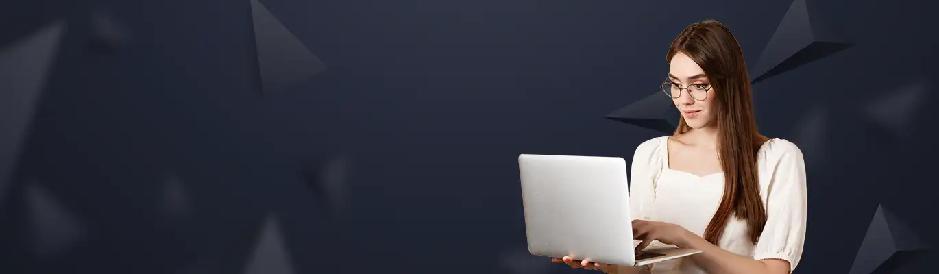 A Laptop is held by a 3D designing professional while she smiles