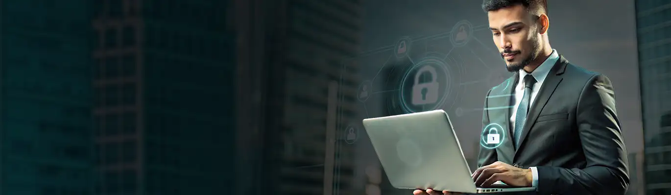 An IT executive working on advanced strategies on a laptop 