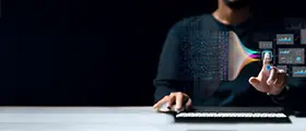 Person using computer with digital data visualization and futuristic technology interface.