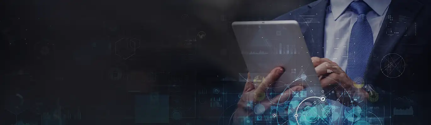 An iPad is held by a IT professional
