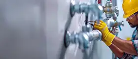 Engineer working on mechanical and plumbing system pipes