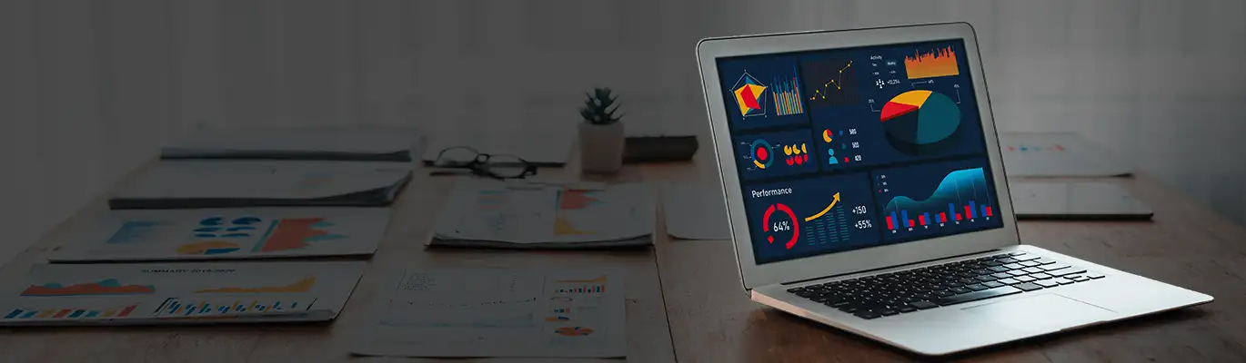 Power BI student sitting infront of a laptop with smiling face