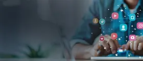 Person using a tablet with floating social media icons representing various platforms.