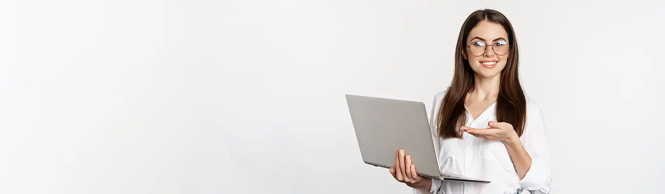 Travel and Tourism student sitting infront of a computer and smiling ,others two discussing together at office enivironment with looking in computer