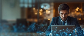 Professional man working on a laptop in a modern office with digital network graphics overlay.