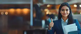 Professional CHRM candidate in formal attire giving a thumbs-up while holding documents, symbolizing Certified Human Resources Manager training in a corporate setting.
