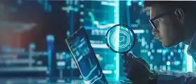 Professional SOC (Security Operations Center) Analyst examining cybersecurity threats on a laptop using a magnifying glass, with digital data and futuristic interface in the background.