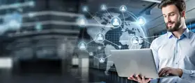 Professional man working on a laptop with digital global network and communication icons representing CompTIA Network+ certification and IT connectivity.