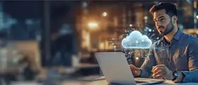 Professional working on a laptop with a glowing cloud computing icon hovering beside him, representing Google Professional Cloud Architect certification and cloud technology.