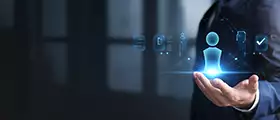 Businessman holding digital hologram icons representing HR and recruitment.