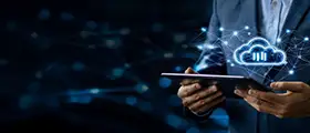 Business professional using tablet with digital cloud computing icon.