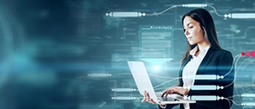 Professional woman using a laptop with a futuristic digital interface, representing Oracle Applications System Administrator Fundamentals training and enterprise IT management.