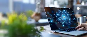 Cybersecurity protection displayed on a laptop with a digital lock icon, representing secure data and network security.