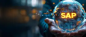 Person holding a glowing digital globe with the text SAP, symbolizing SAP certification and enterprise software solutions.