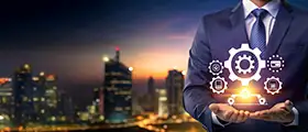 A professional Supervisory illustration showing a business leader holding digital gear icons symbolizing leadership, team management, and operational control against a modern cityscape background.
