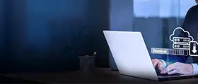 Professional working on a laptop with a cloud server download icon overlay, representing Windows Server Administration and data management.