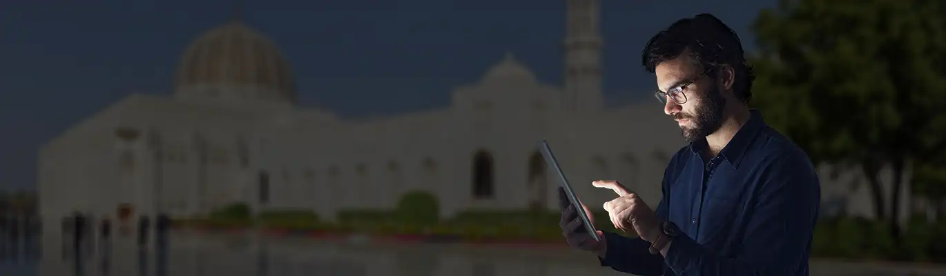 A Cyber Security Student Checking on Tablet at a Training Institution in Muscat