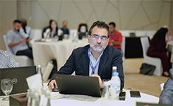 Professional participating in Edoxi's Artificial Intelligence (AI) corporate training led by Manish at DoubleTree by Hilton, Dubai.