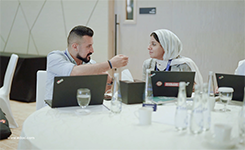 Corporate professionals discussing during a session break at Edoxi's Artificial Intelligence (AI) corporate training conducted by Manish at DoubleTree by Hilton, Dubai