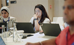 Corporate professional attentively following Edoxi's Artificial Intelligence (AI) corporate training session conducted by Manish at DoubleTree by Hilton, Dubai