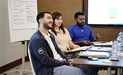Corporate professionals participating in Edoxi's Assertive Career Excellence training session focused on communication and career development at Al Jaddaf Rotana Hotel, Dubai.