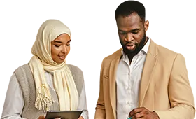 Corporate training session in Riyadh with a business professional speaking into a microphone, addressing an audience in a conference room.